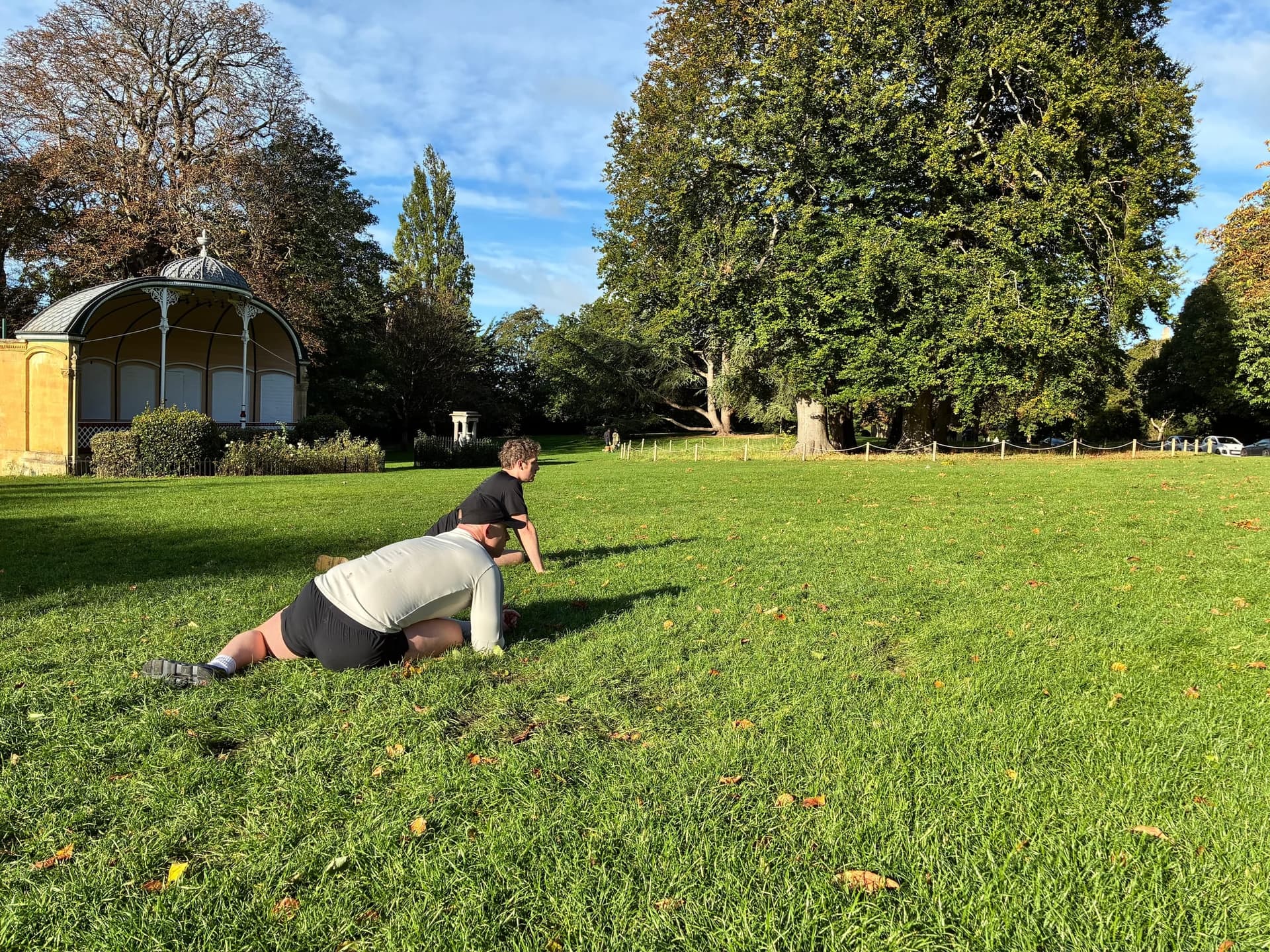 Stretching out on the grass after the game.