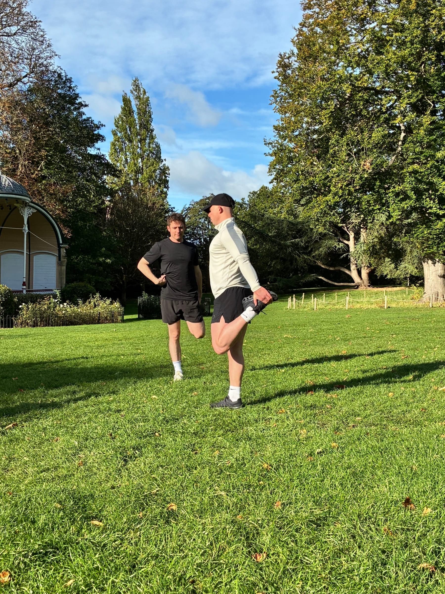 Mid-kick during a game on the grass.