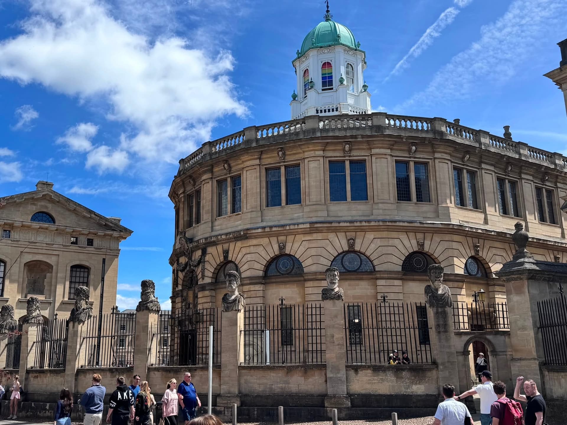The Sheldonian Theatre under a clear blue sky.